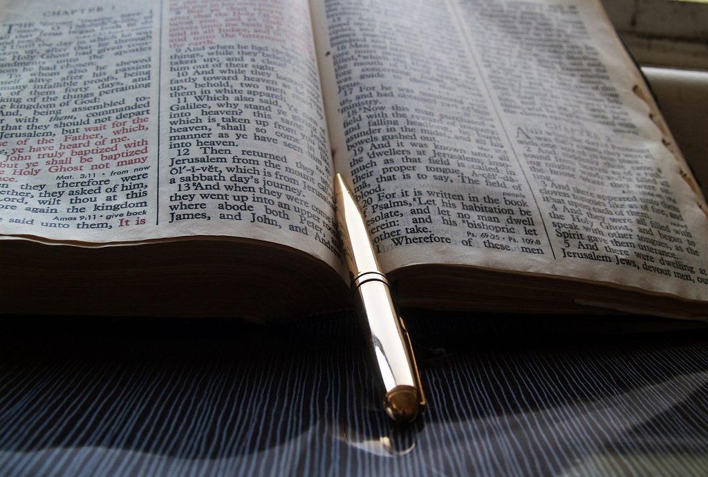 Pen resting on a bible