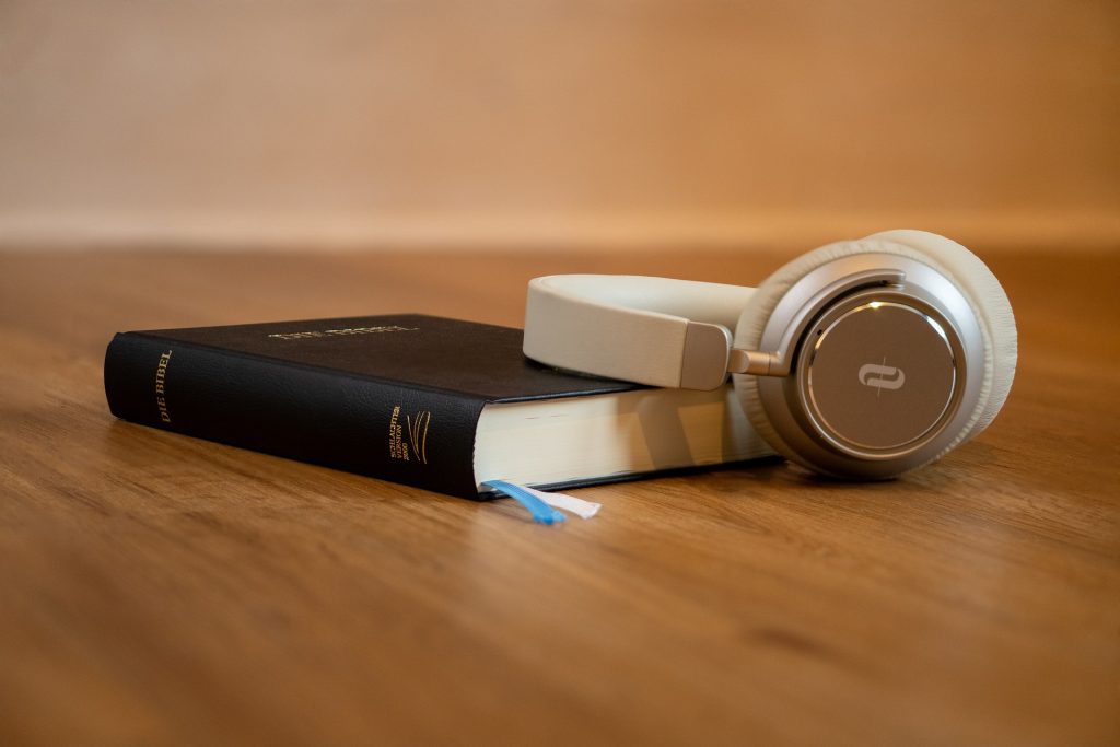 headphones on bible